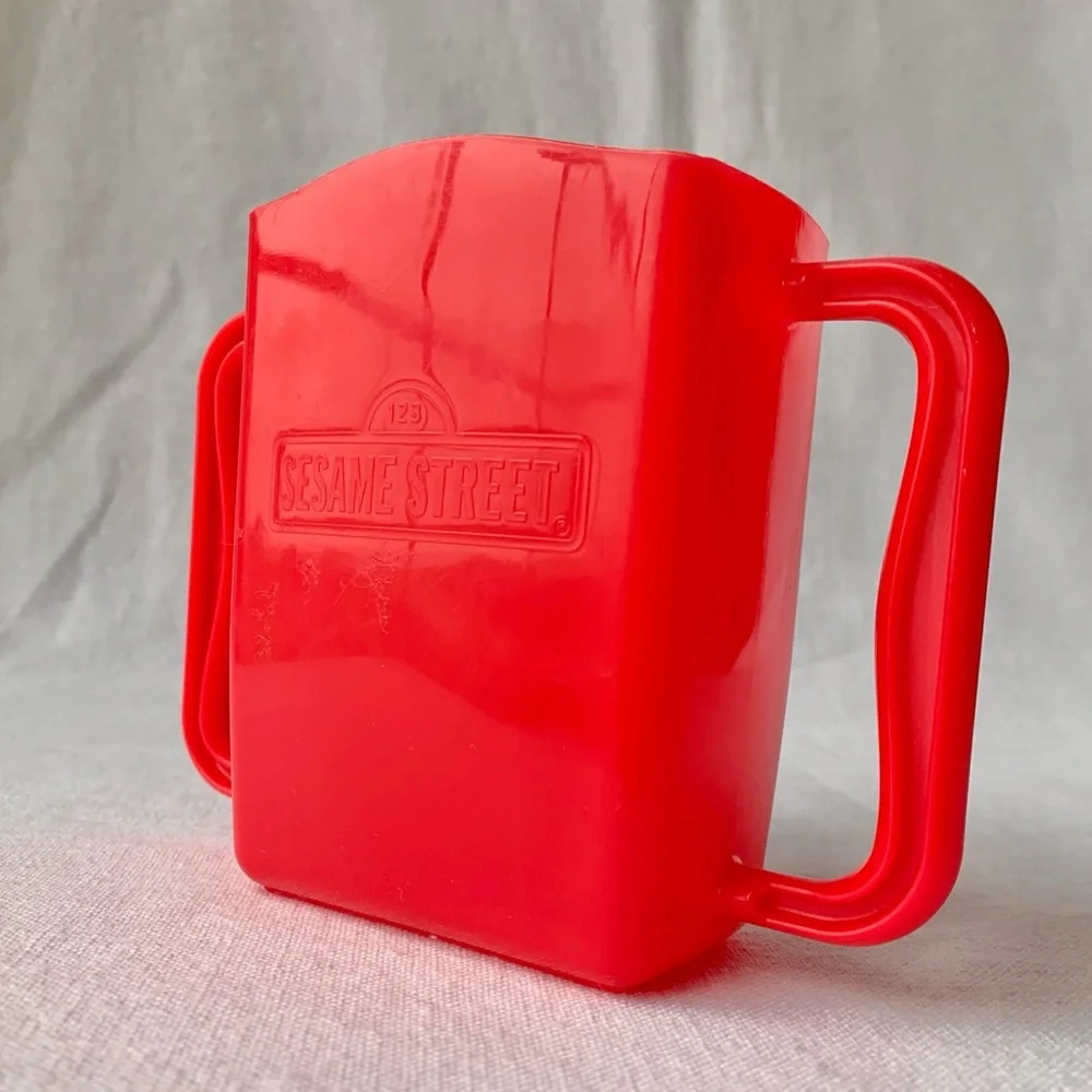 2013 Sesame Street Cookie Monster Kids Red Plastic Juice Box Holder with Handles